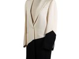 the coat is white and black and has a black lapel