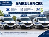 a group of ambulances parked in front of a building