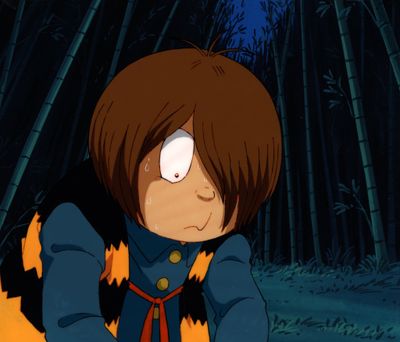 cartoon image of a boy with a cat tail sitting in front of a bamboo forest