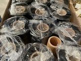 many rolls of tape in a box on the floor