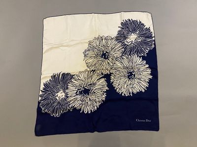 blue and white floral print scarf on a white background
