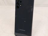 the back of a black samsung galaxy s9 phone on a white surface