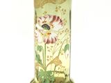 a glass vase with a floral design on it