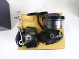a picture of a fishing reel and a reel on a table