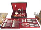 a red case with silverware in it on a table