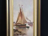 painting of a sailboat on a body of water in a gold frame