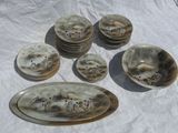 five plates and two bowls on the table