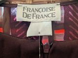 the label of a dress is on a hanger on a mannequin mannequin mannequin mannequin mannequin mannequin manne