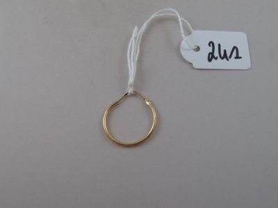 a gold ring hanging from a string with a price tag on it