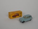 a small blue toy car next to a yellow box