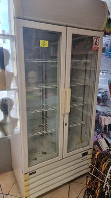 a refrigerator that is sitting in the middle of a store