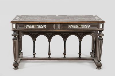 an old wooden table with two drawers and a marble top