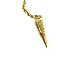 a close up of a gold necklace with a spike on it