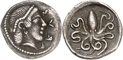 a silver coin with an image of a woman and an octopus on it