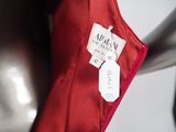 a label on a red jacket on a mannequin mannequin mannequin mannequin mannequin mannequin mannequin mann