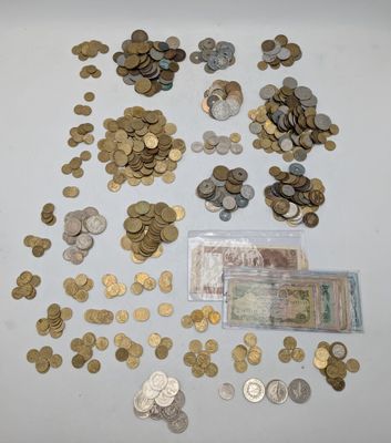 a lot of coins that are on top of a table