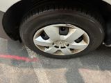 a close up of a tire on the side of a car