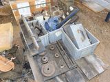 a machine that is sitting on a pallet in the dirt