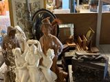 several figurines are on a table in a store