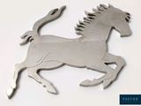a metal horse that is standing on its hind legs