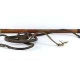 an old baseball bat and a snake on a white background