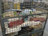 a metal cage filled with lots of food in a store