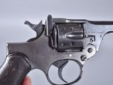 someone is holding a gun in their hand on a white background