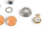 many different types of jewelry on a white surface