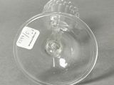 a clear wine glass with a label on it