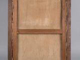 an old wooden picture frame with a piece of wood in it
