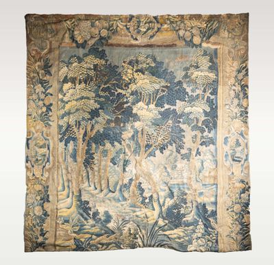 an antique tapestry with a picture of a forest scene on it