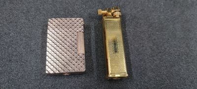 two different types of lighters sitting on top of a table