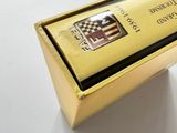 an image of a gold box with a black and white checkered flag on it