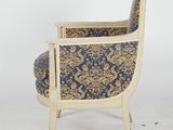 an image of a chair with a blue and gold upholstered upholstered back