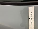 a measuring tape on the back of a car ' s trunk