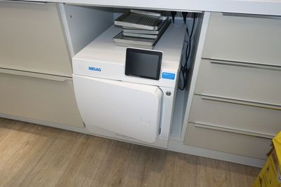 a microwave that is sitting on top of a cabinet