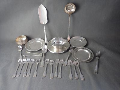 a lot of silverware on a table with spoons and forks