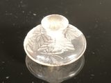 a glass jar with a lid sitting on a black surface