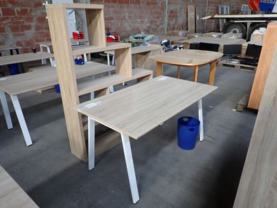many tables and chairs in a room with a brick wall