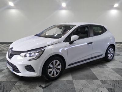 the white car is parked on a checkered floor in the garage