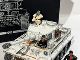 a small toy tank with soldiers on it next to a box