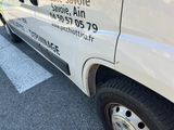 a white van that is parked on the side of the road