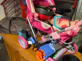 a baby stroller and other items on a dresser in a room