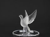 crystal dove figurine on a black background