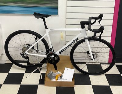 a bike that is sitting on a box on the floor