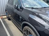 a picture of a black suv parked in a parking lot