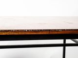 a wooden table with a vase on top of it