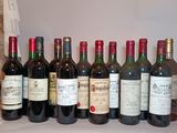 many bottles of wine lined up on the counter
