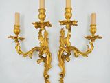 pair of antique brass wall sconces in the style of louis xv