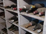 many bottles of wine on the shelves in the room